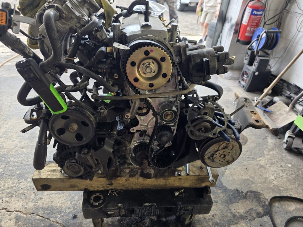 Refurbished cylinder head being fitted to replacement Bongo engine