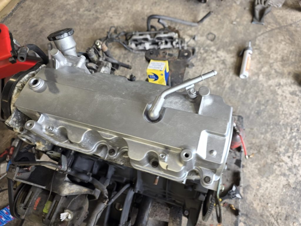 Refurbished cylinder head being fitted to replacement Bongo engine
