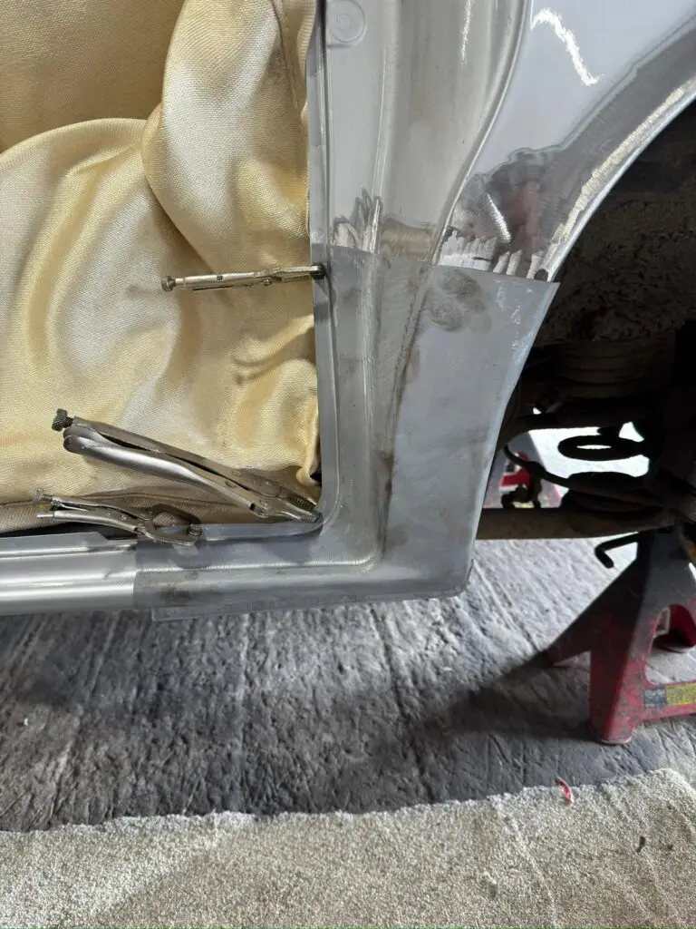 New factory style Mazda Bongo rear arch panel positioned for test fitting