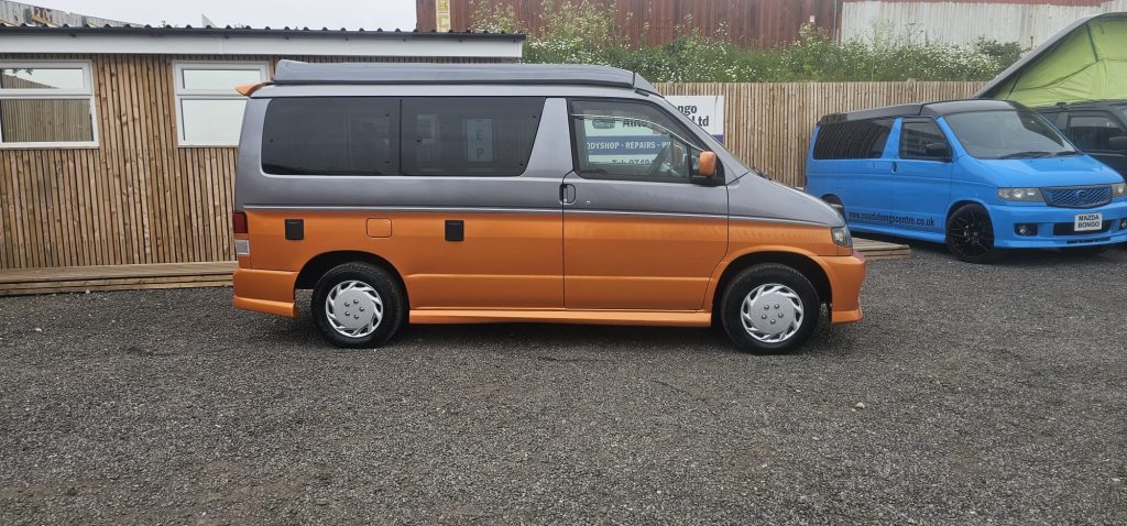 Completed Mazda Bongo respray in pearl orange and grey