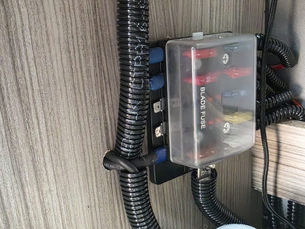 Rewired and relocated fuse box inside Mazda Bongo for improved safety