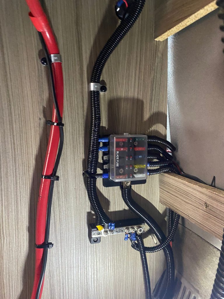 Rewired and relocated fuse box inside Mazda Bongo for improved safety