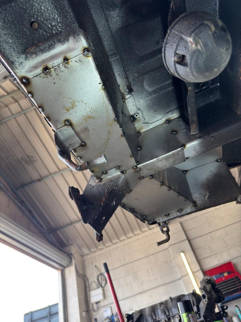 New metal panel tacked into Mazda Bongo chassis during restoration