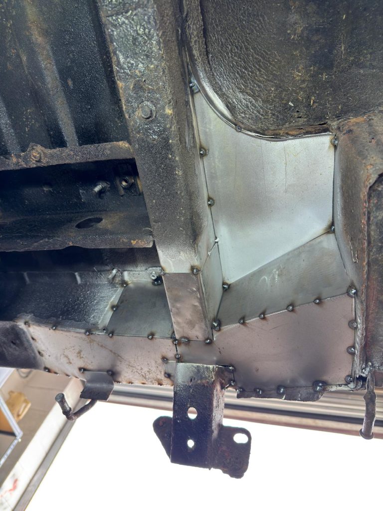 New metal panel tacked into Mazda Bongo chassis during restoration