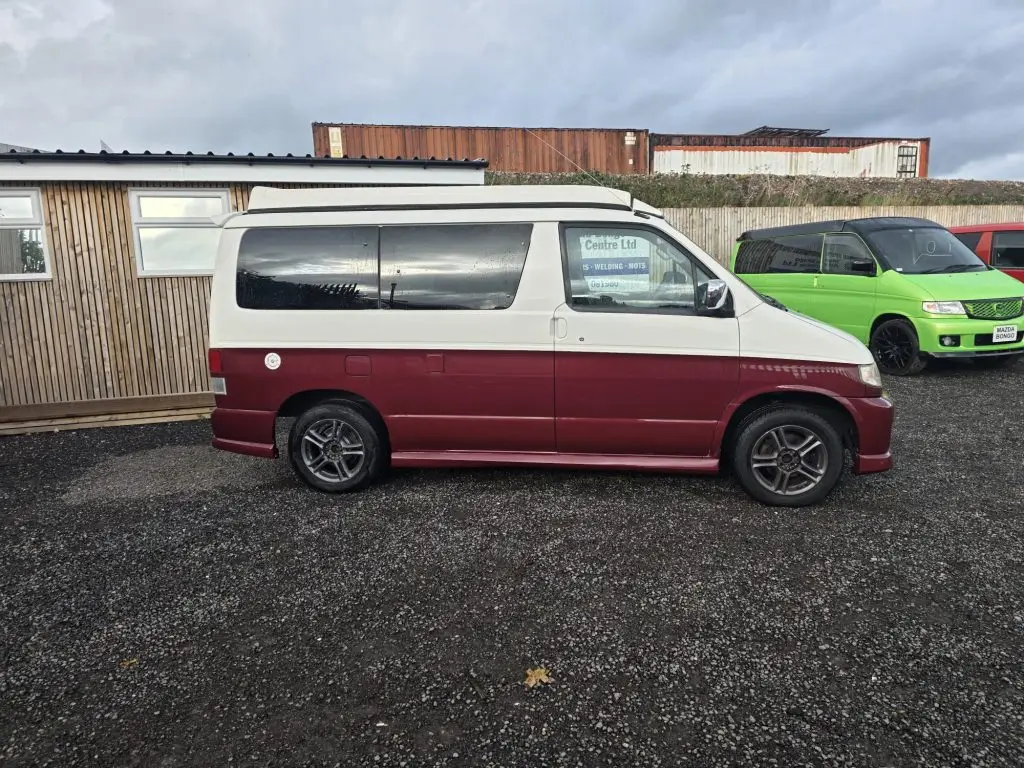 Mazda Bongo after Bronze Restoration with deep ruby red pearl finish and new wheel arches