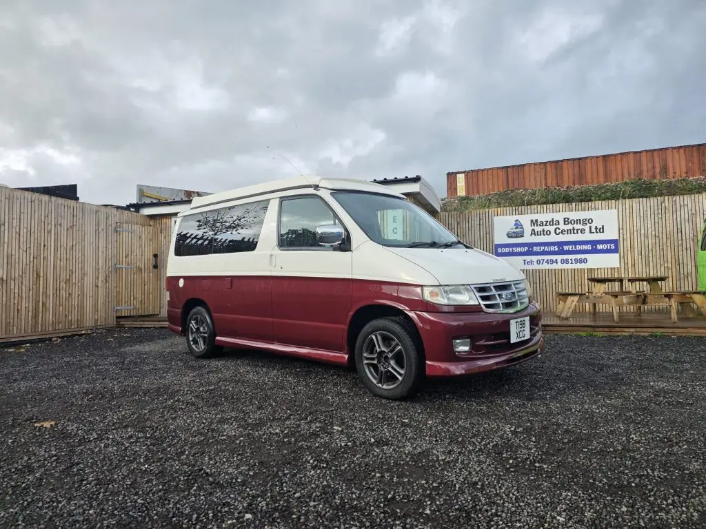 Mazda Bongo after Bronze Restoration with deep ruby red pearl finish and new wheel arches