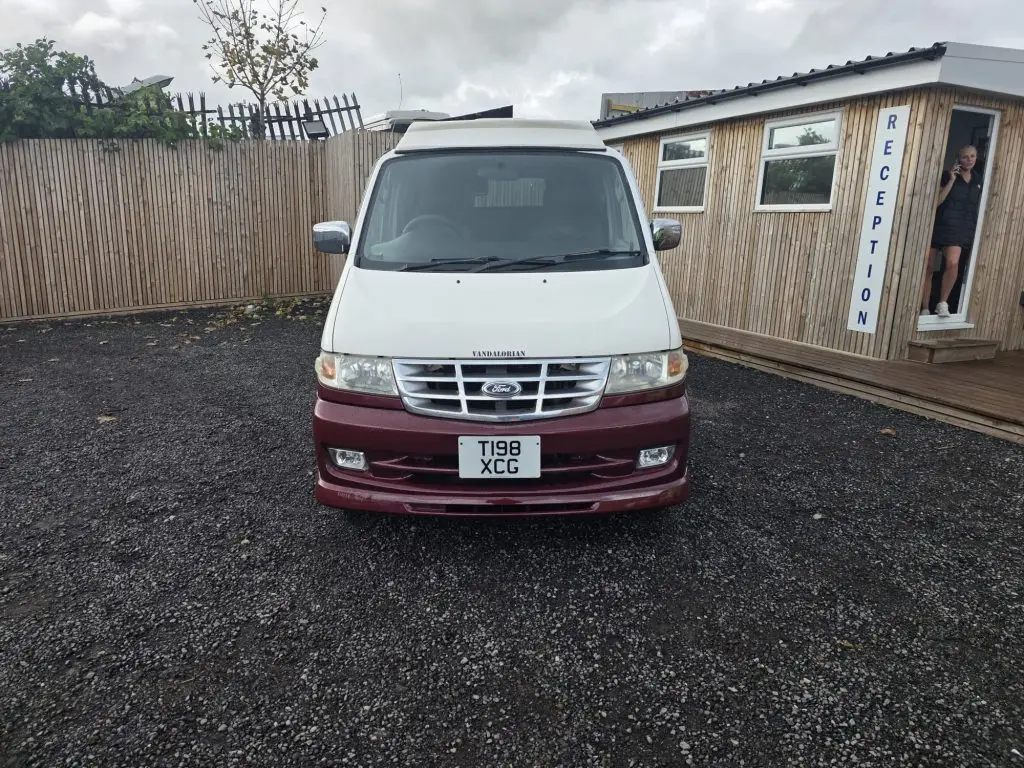 Mazda Bongo after Bronze Restoration with deep ruby red pearl finish and new wheel arches