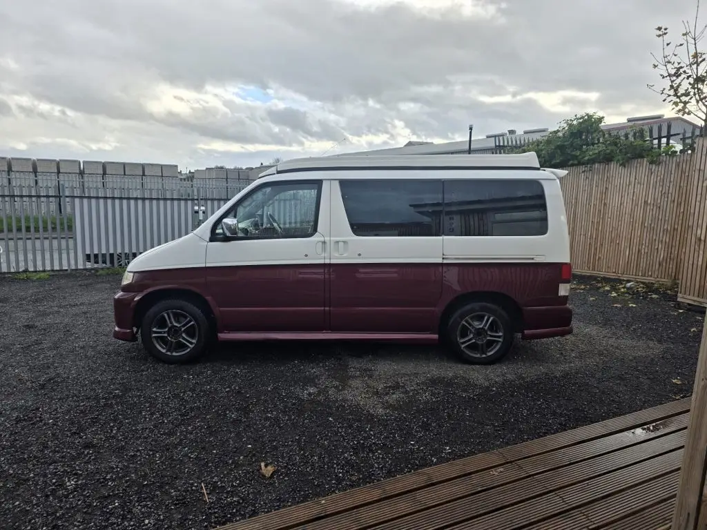 Mazda Bongo after Bronze Restoration with deep ruby red pearl finish and new wheel arches