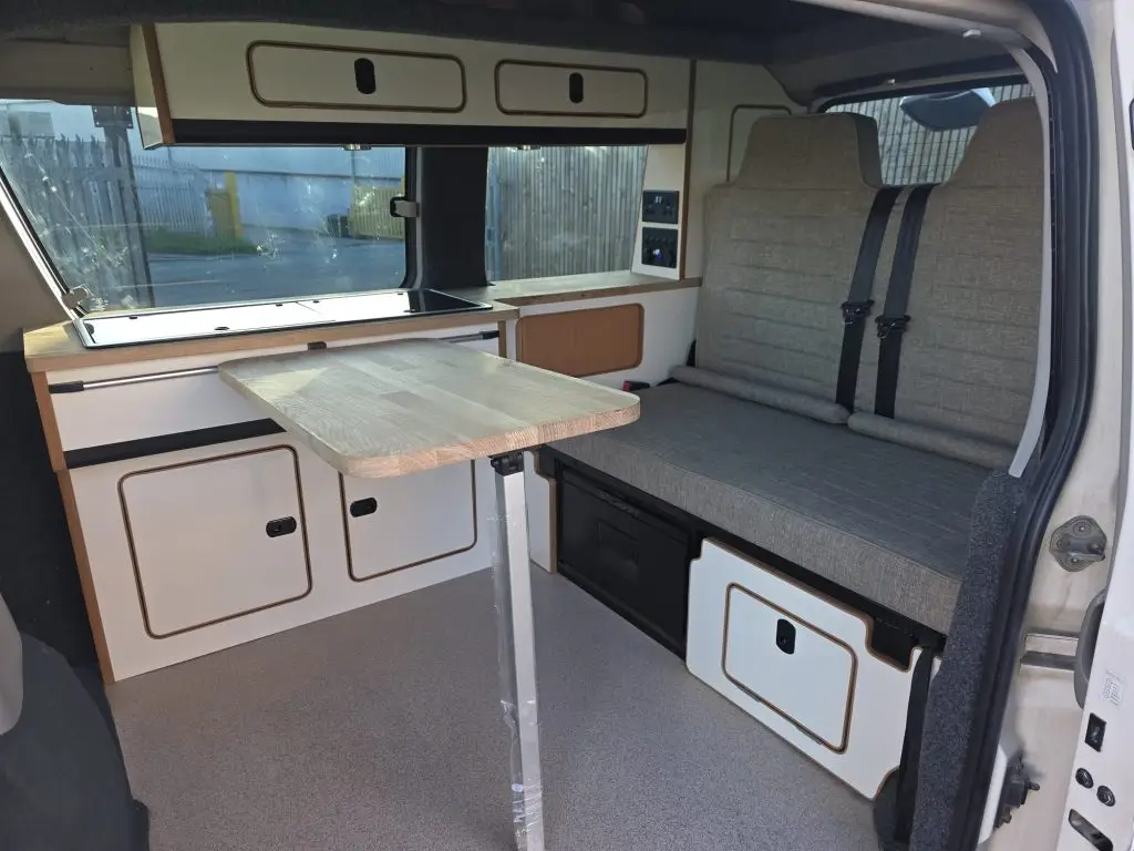 Slimline side conversion with reupholstered rock and roll bed