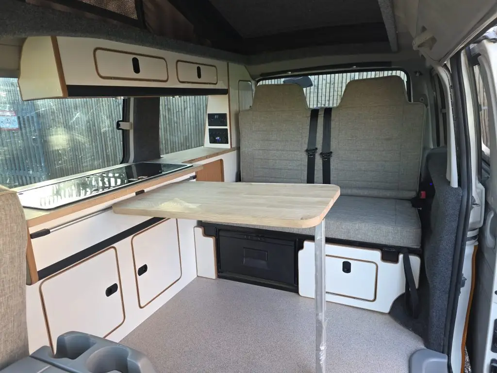 Slimline side conversion with reupholstered rock and roll bed