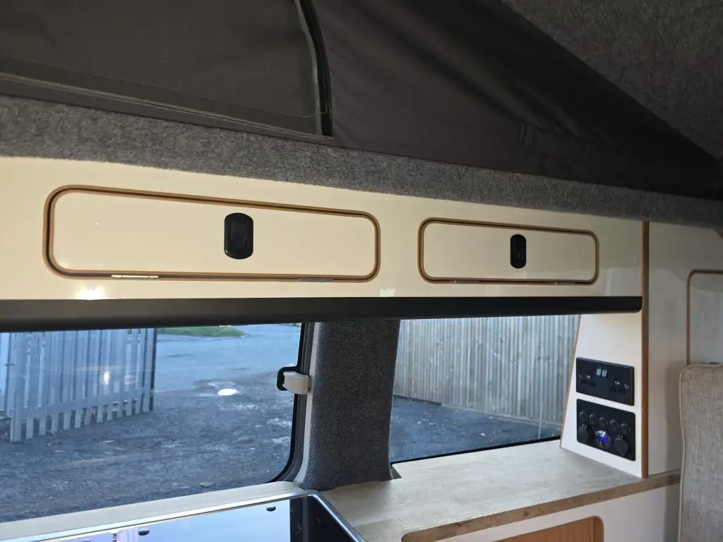 Slimline side conversion with reupholstered rock and roll bed