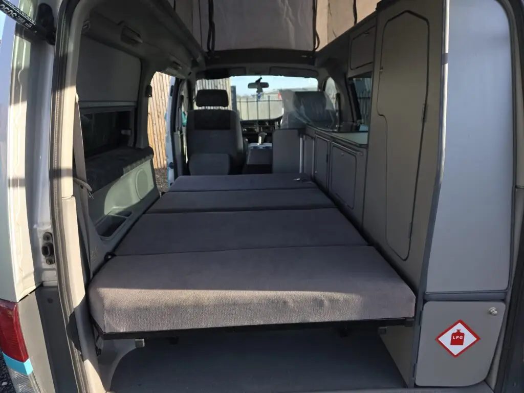 Interior of Mazda Bongo full side conversion with rock and roll bed