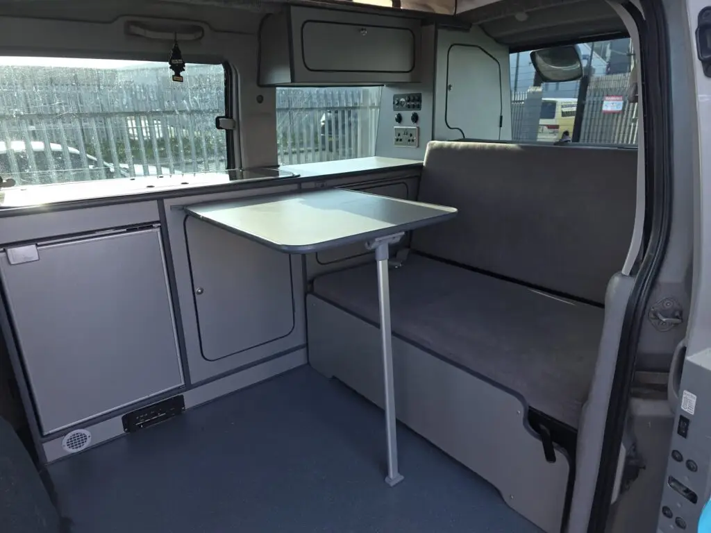 Interior of Mazda Bongo full side conversion with rock and roll bed